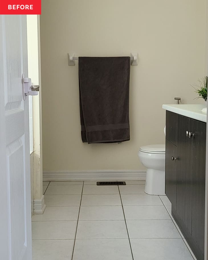Bath towel hanging in bathroom before renovation.
