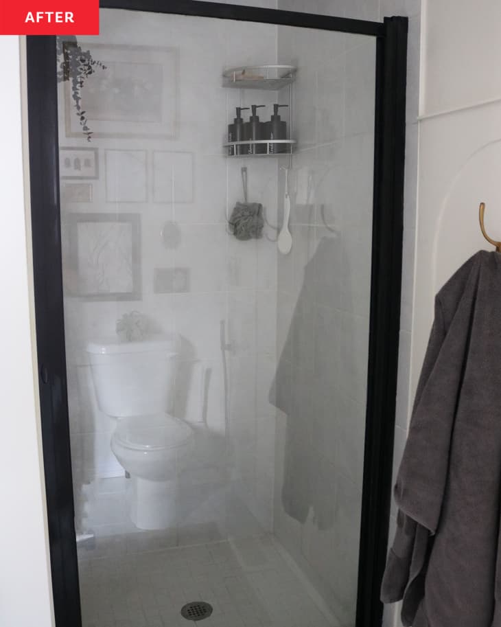 Black trim and glass door to stand up shower .