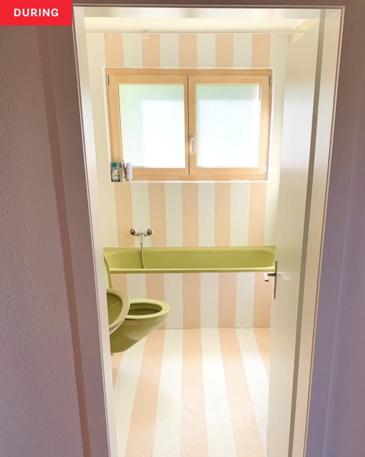 During: Bathroom with peach-colored stripes and green tub, sink, and toilet