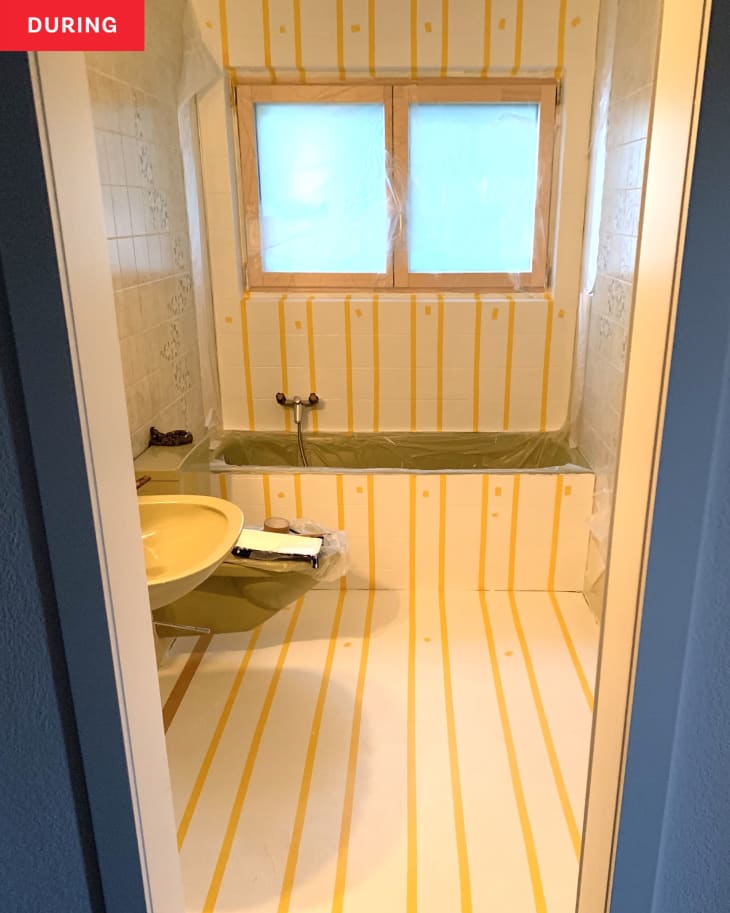 During: Bathroom with painters tape stripes