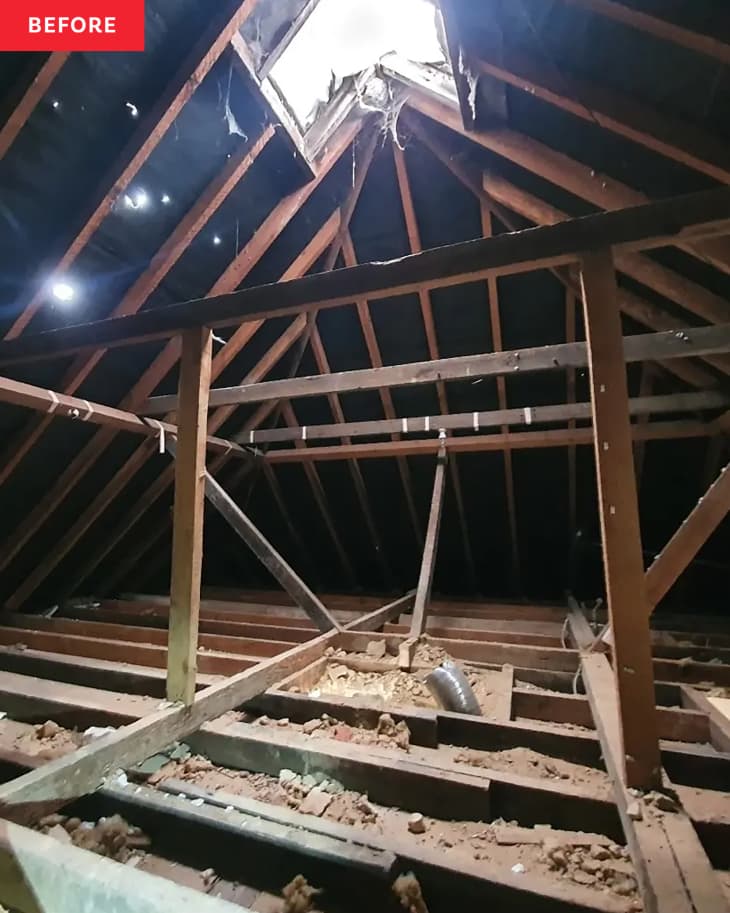 Attic during renovation with skylight cut out of ceiling.