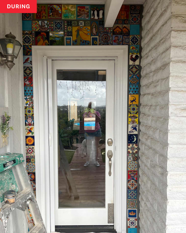 front door after renovation--homeowner added colorful tiles all the way around the door. Project almost finished