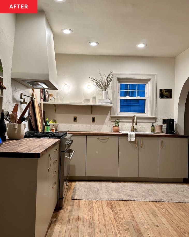 Neutral colored kitchen with open cabinets after renovation.