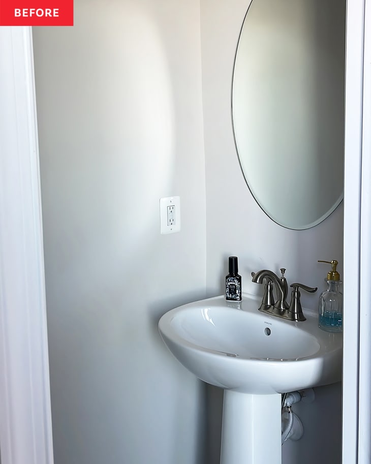 White pedestal sink in bathroom before renovation.