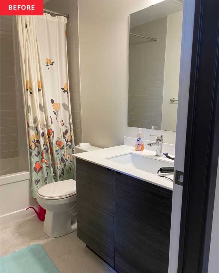 Bathroom before renovation/makeover/remodel: White walls, white sink, white floor, cream floral shower curtain