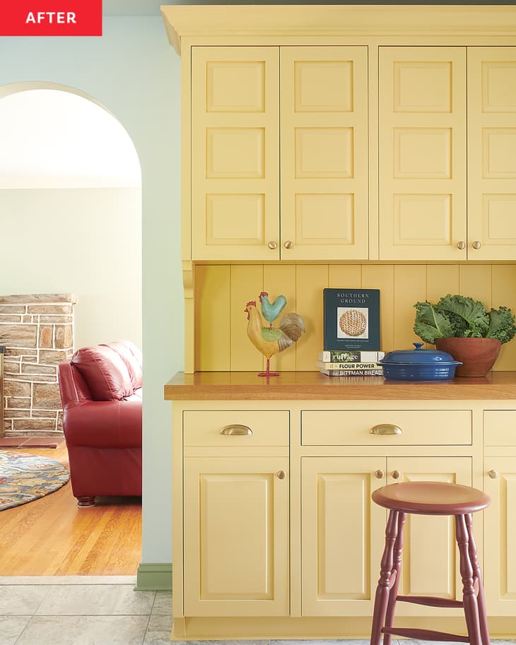Yellow baking hutch in newly renovated kitchen.