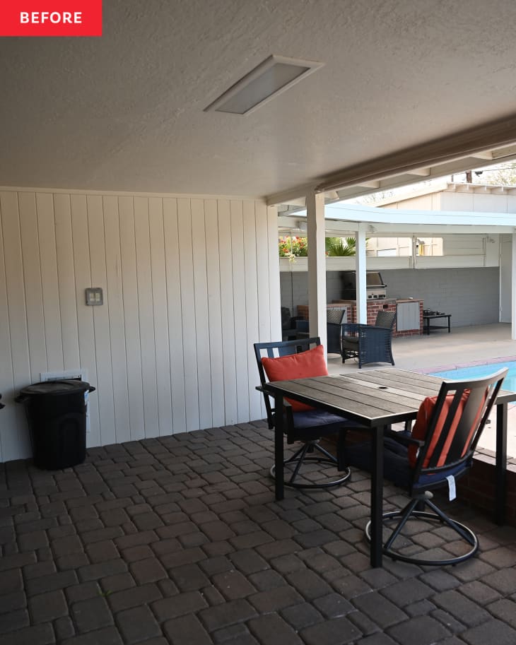 Dark patio area with seats in backyard before renovation