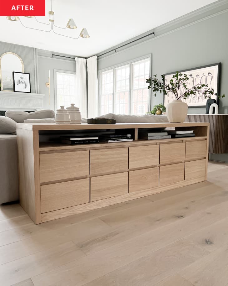 After: a long wooden table behind a couch with two shelves and ten drawers