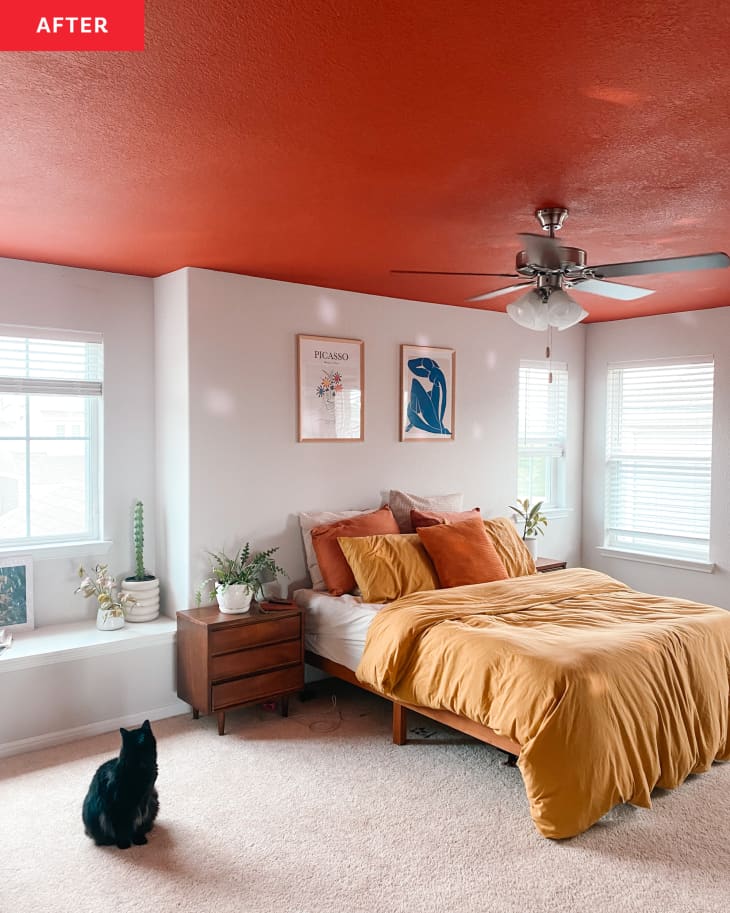 After: Bedroom with red-orange ceiling with lots of natural light pouring in