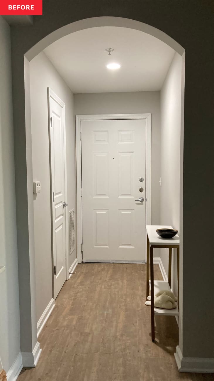 Entryway before makeover: gray walls, white door, white console table