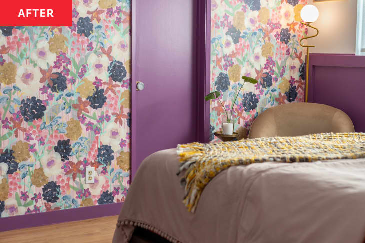 Floral wallpaper with dark purple painted door and trim in newly renovated home.