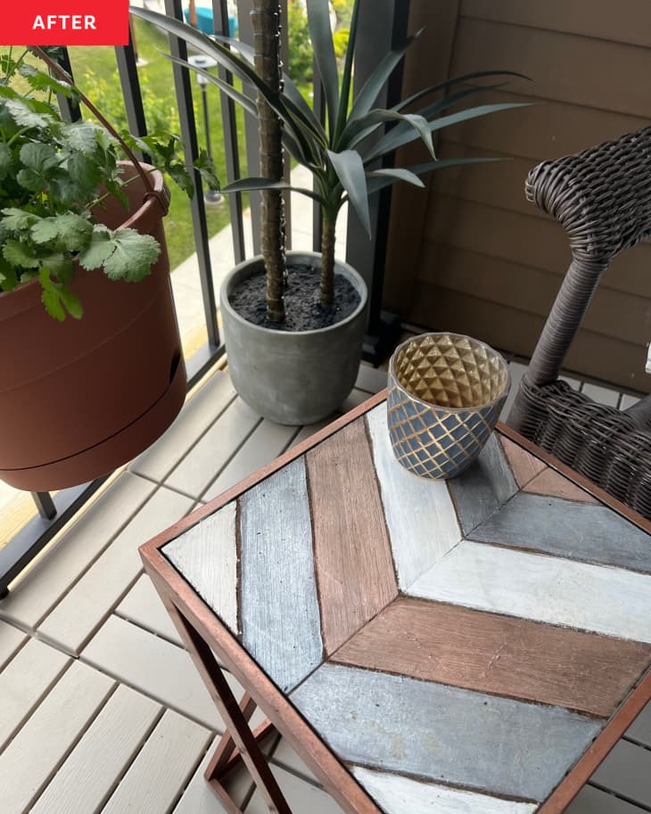 Chevron painted outdoor side table in newly renovated balcony space.