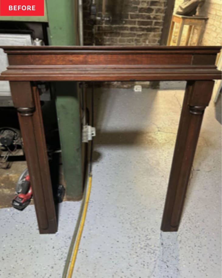 Before: A vintage wood fireplace surround in a dark brown tone.