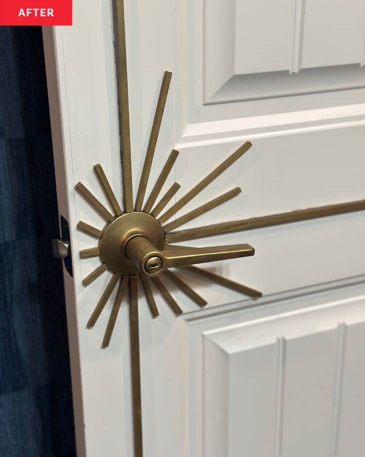 Sunburst door knob hardware on bathroom door.