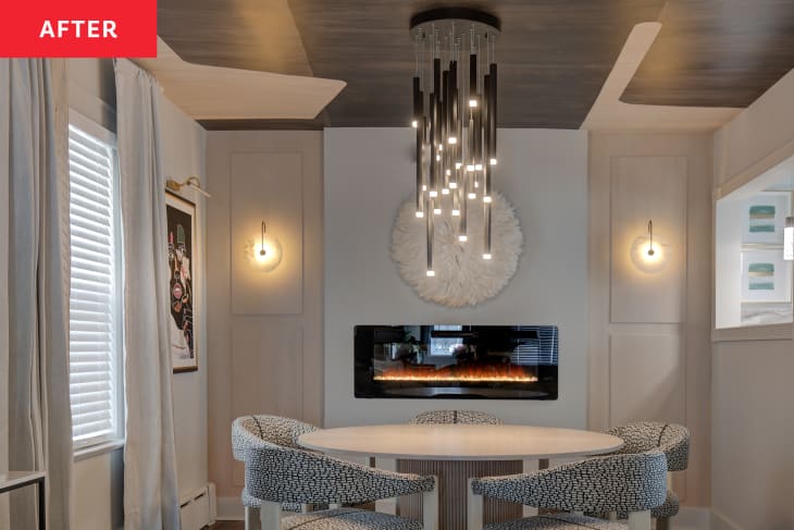 Multi-layered light pendant hangs above table in newly renovated dining room.