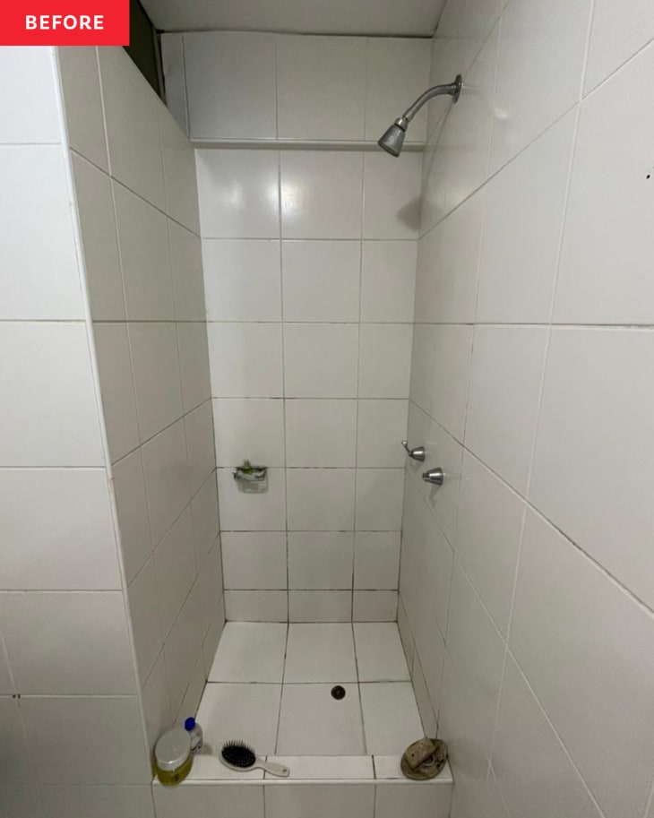 White tile in walk in shower before renovation.