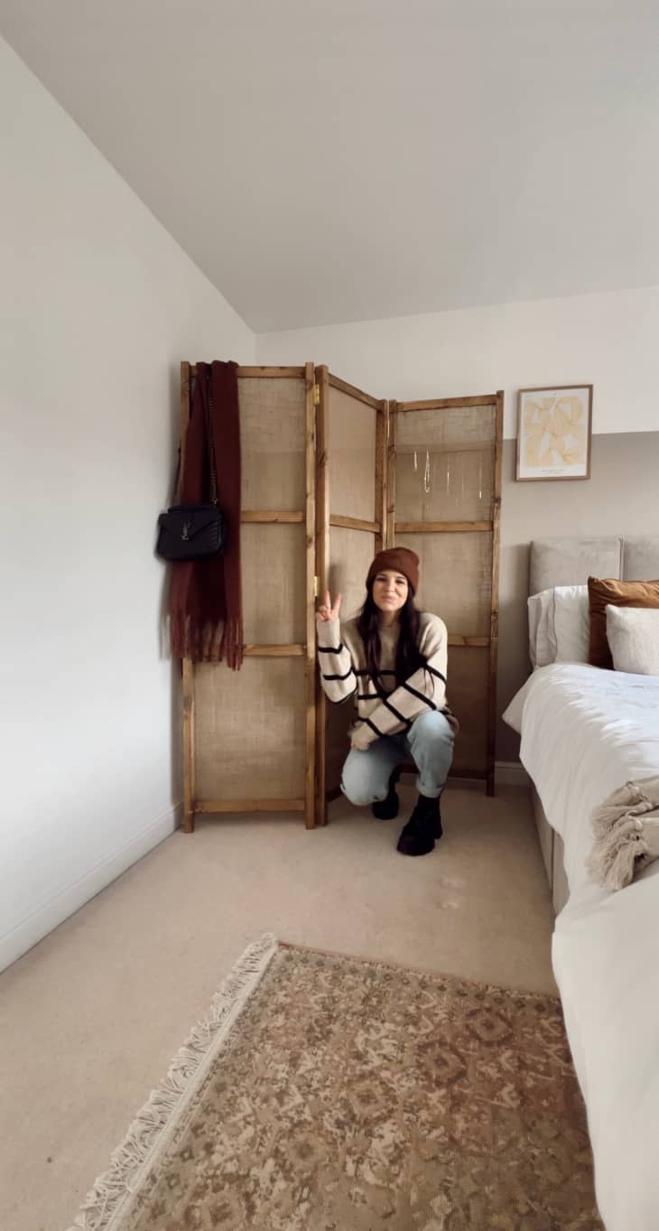 Woman in front of room divider made from IKEA TARVA sides