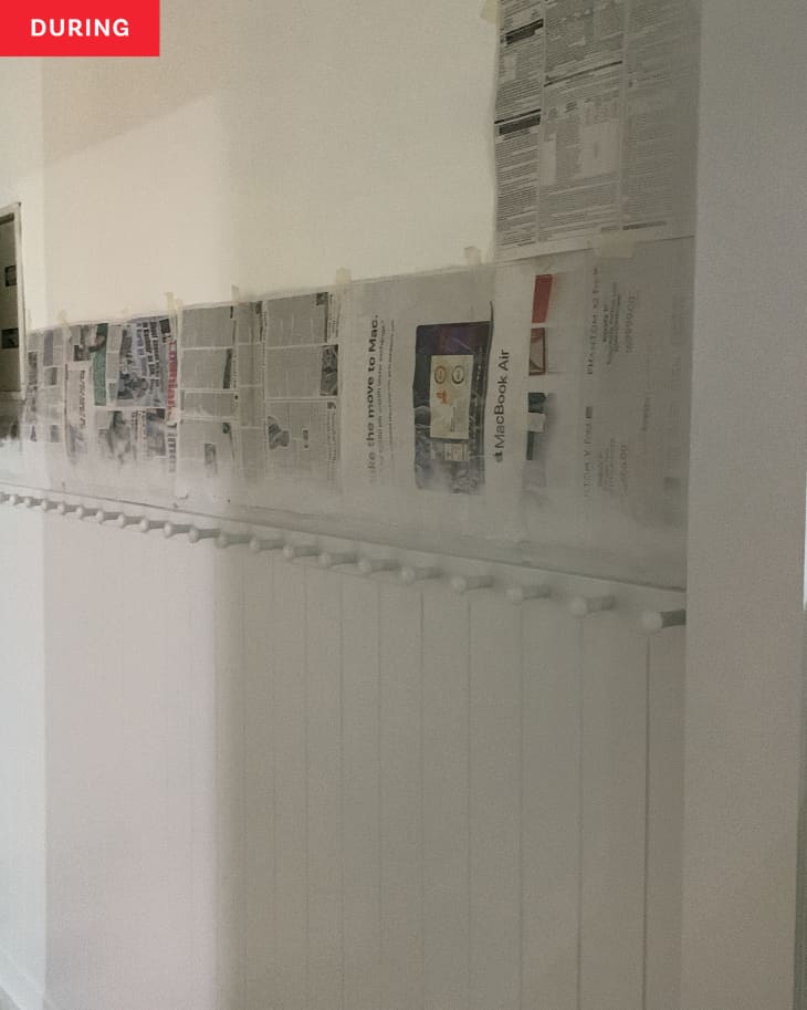 Newspapers used to cover wall while painting wainscoting.