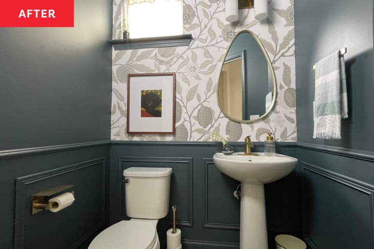 After: A dark blue bathroom with a floral accent wall