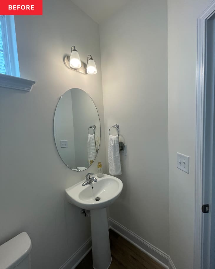Before: a gray bathroom with a round mirror and white sink
