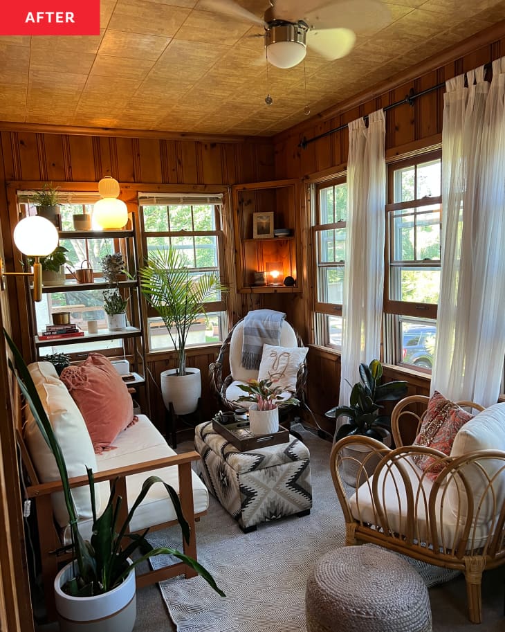 Wicker furniture in newly renovated sunroom with various lamps around the room.