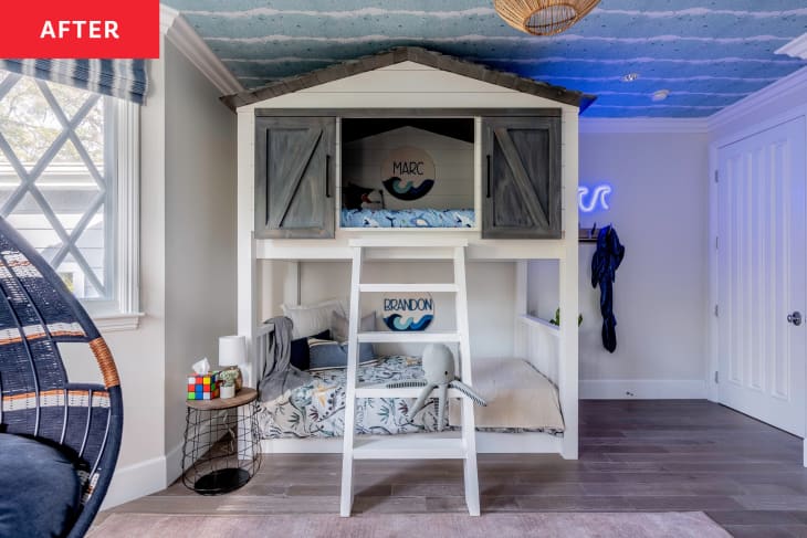 After: a house shaped kids bunk bed in a blue and white room