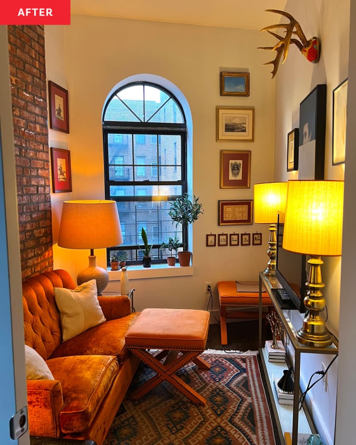 After: a living room with an orange couch and art on the walls