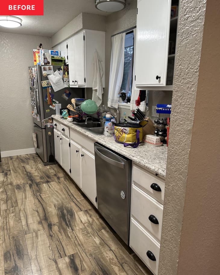 fridge, dishwasher, narrow cabinets, window above sink, cluttered counter