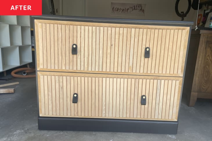 light oak wood slated front of drawers, black body top and sides of dresser, modern pull tabs in black