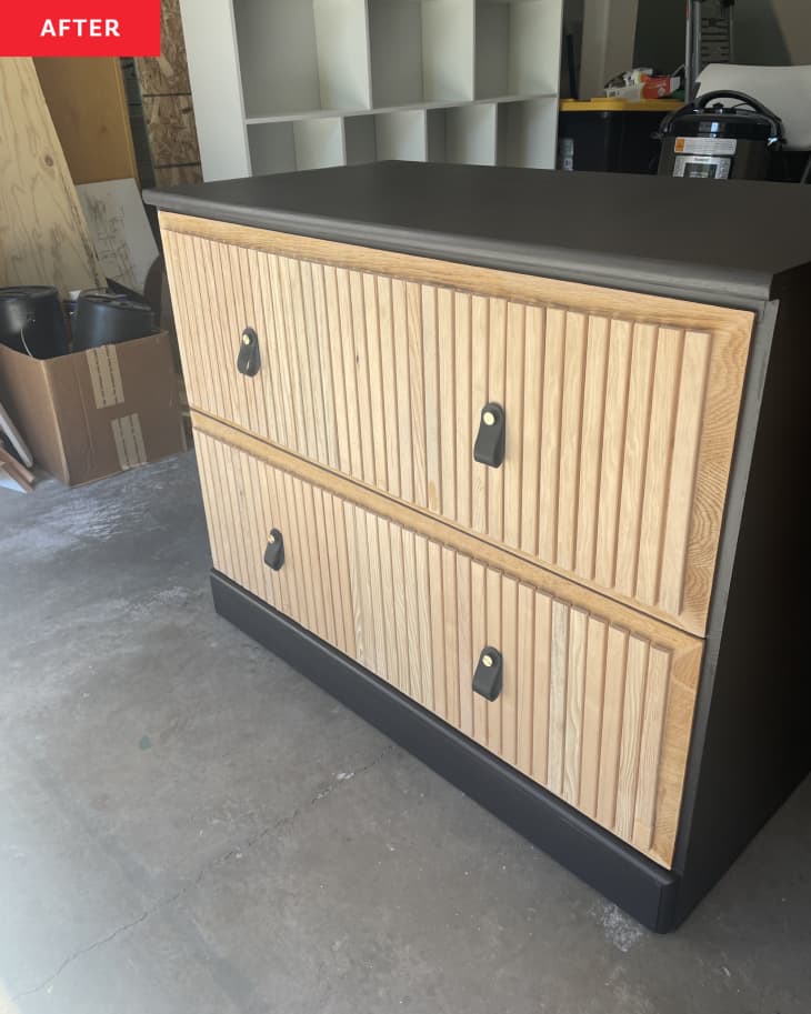 light oak wood slated front of drawers, black body top and sides of dresser, modern pull tabs in black