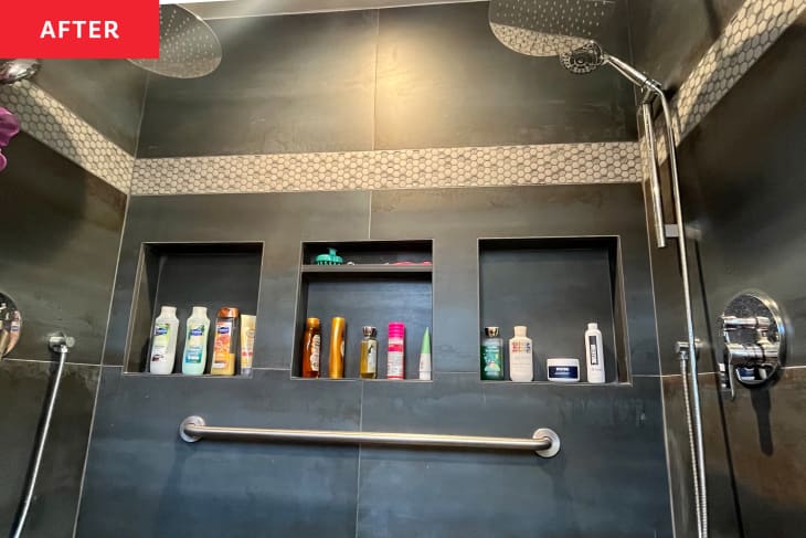 Bathroom products stored in built-in shelves in newly renovated shower.