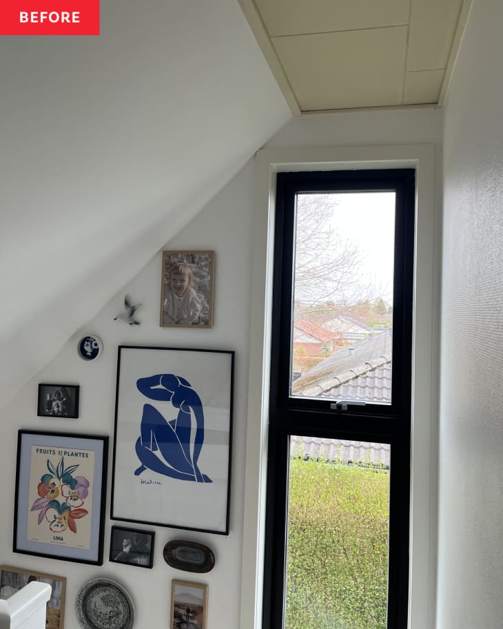 white walls, gallery wall, black window frame, skinny window, angled ceiling, railing