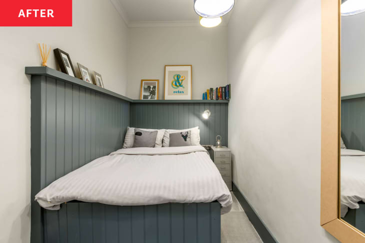 white bedroom with blue wall paneling after makeover