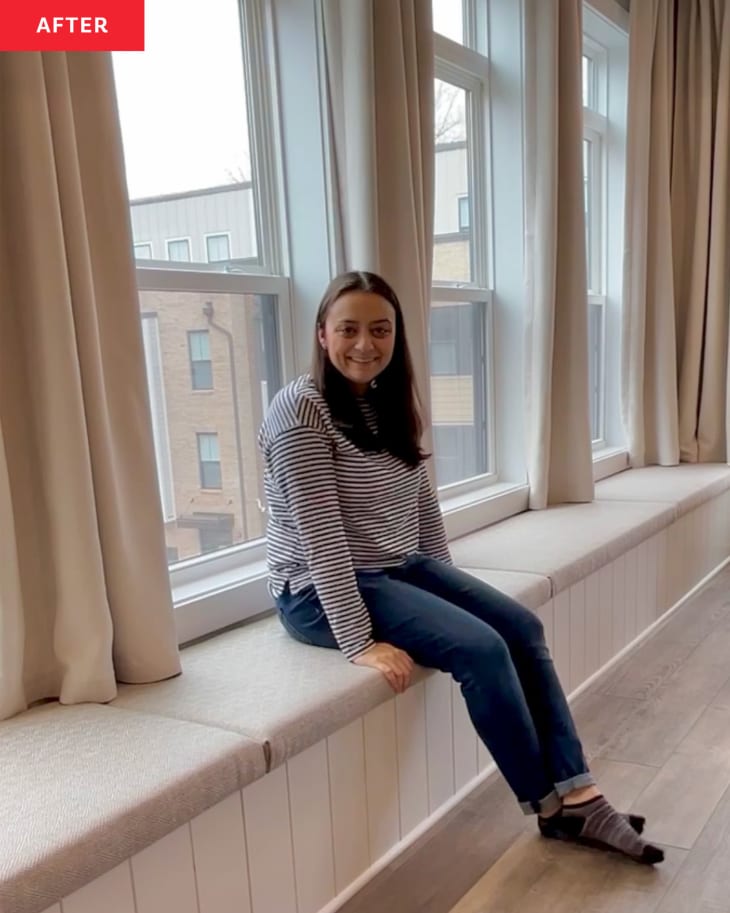 A dweller poses on the completed bench seating with hidden storage.