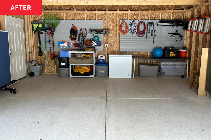 An organized two-car garage with items sorted.