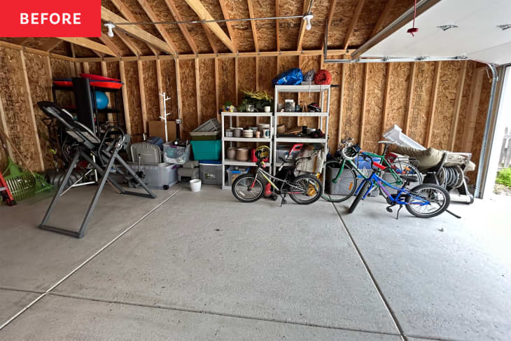 A two-car garage with items shoved against the wall.