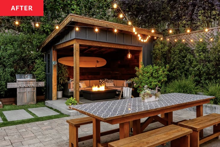 Picnic table in front of covered lounge area in backyard