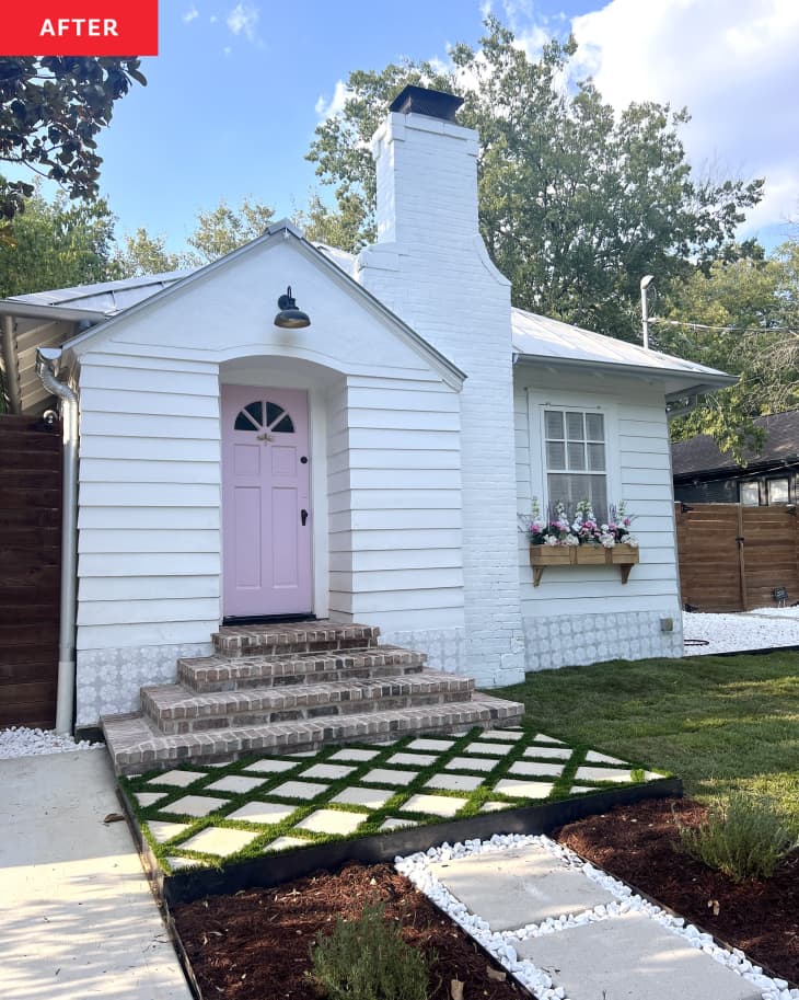 A white house with a pink front door