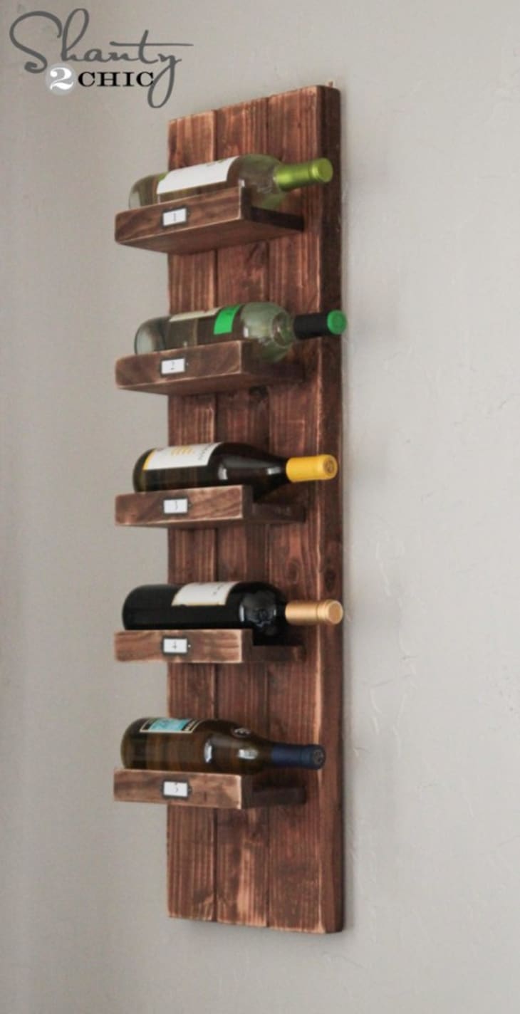 Vertical wood wine rack on a wall