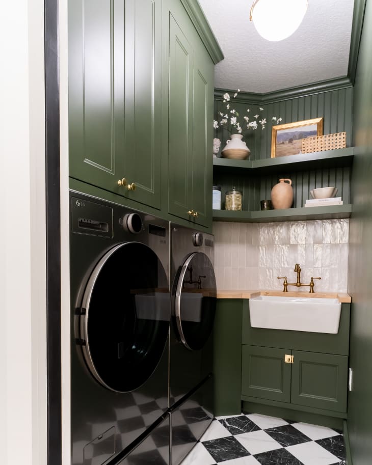 Green painted laundry room after renovation.