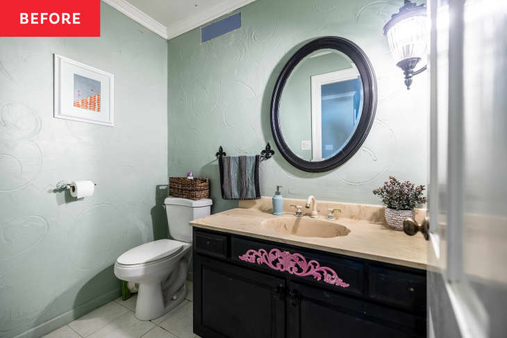 Light green bathroom with stucco walls before renovation.