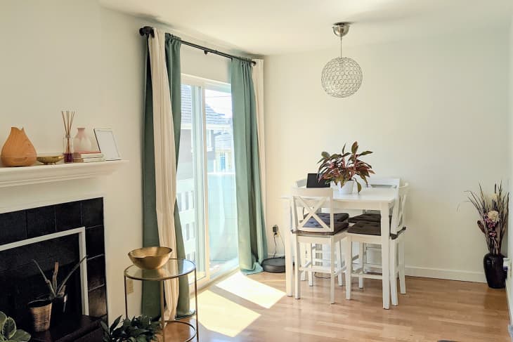 Small white dining room table after renovation.