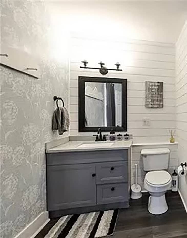 Gray vanity in bathroom before renovation.
