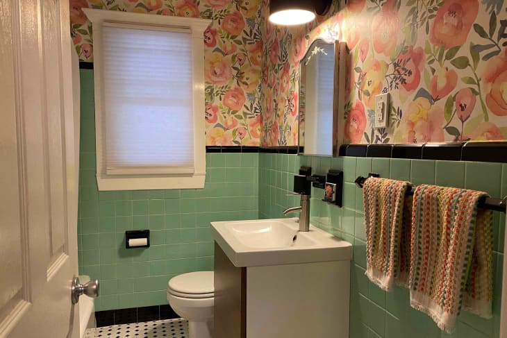 Floral wall paper in bathroom after renovation.