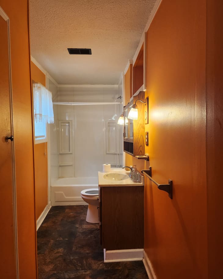 Yellow bathroom before renovation.
