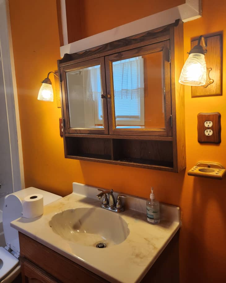 Yellow bathroom before renovation.