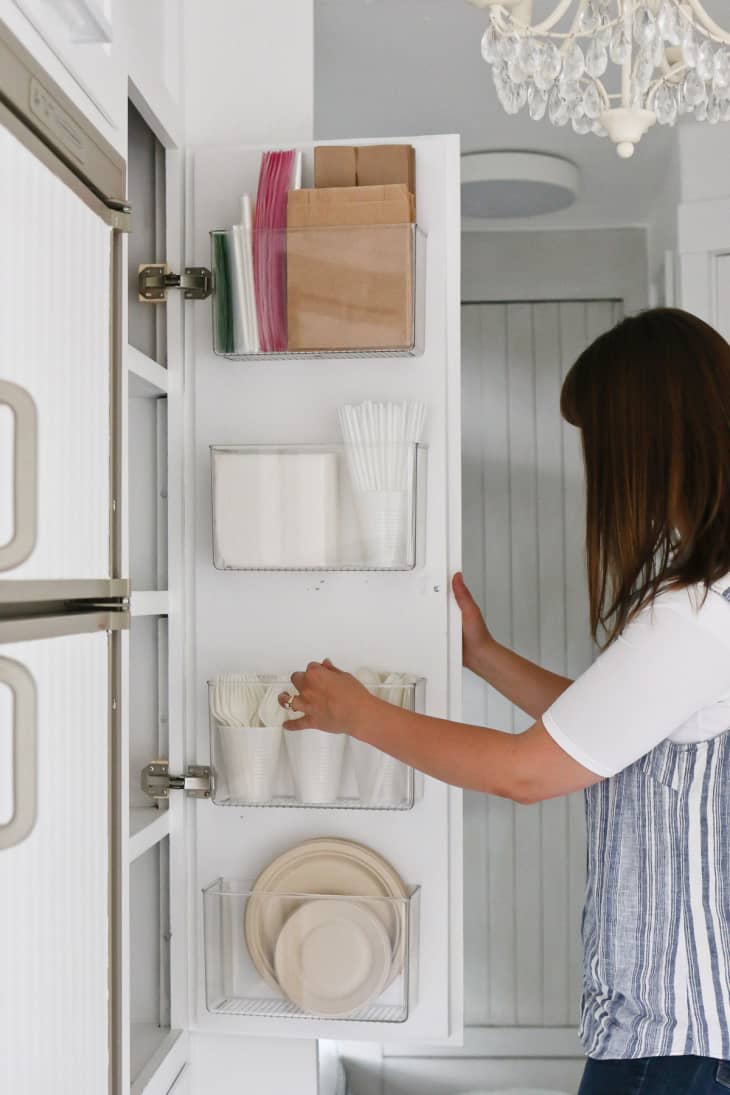 clear storage containers built into a pantry door
