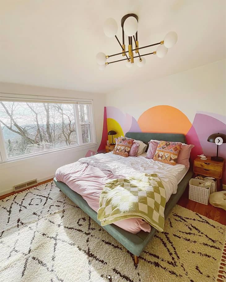 Colorful decals behind bed.