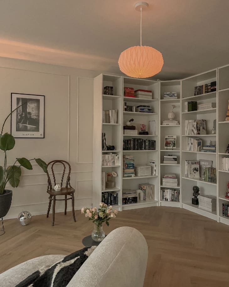 White IKEA BILLY bookcases in a corner of a room