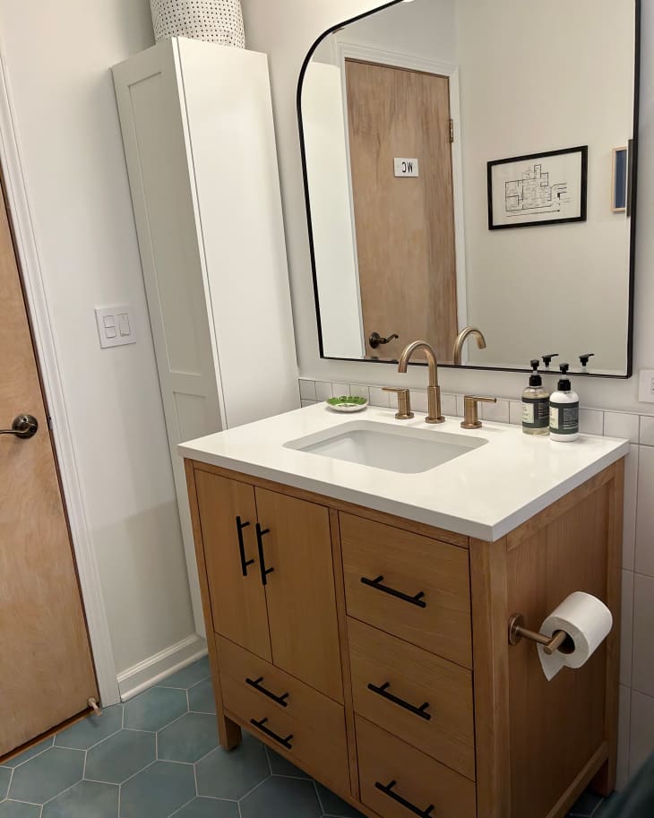 Newly renovated bathroom with wooden vanity.